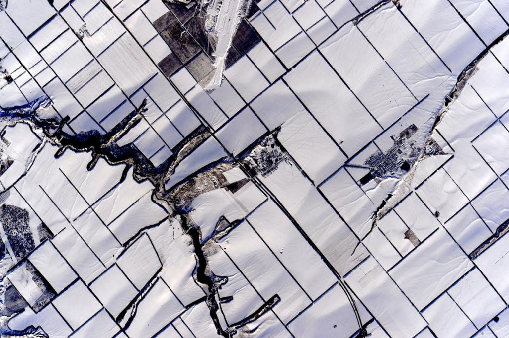 Snow-covered fields.