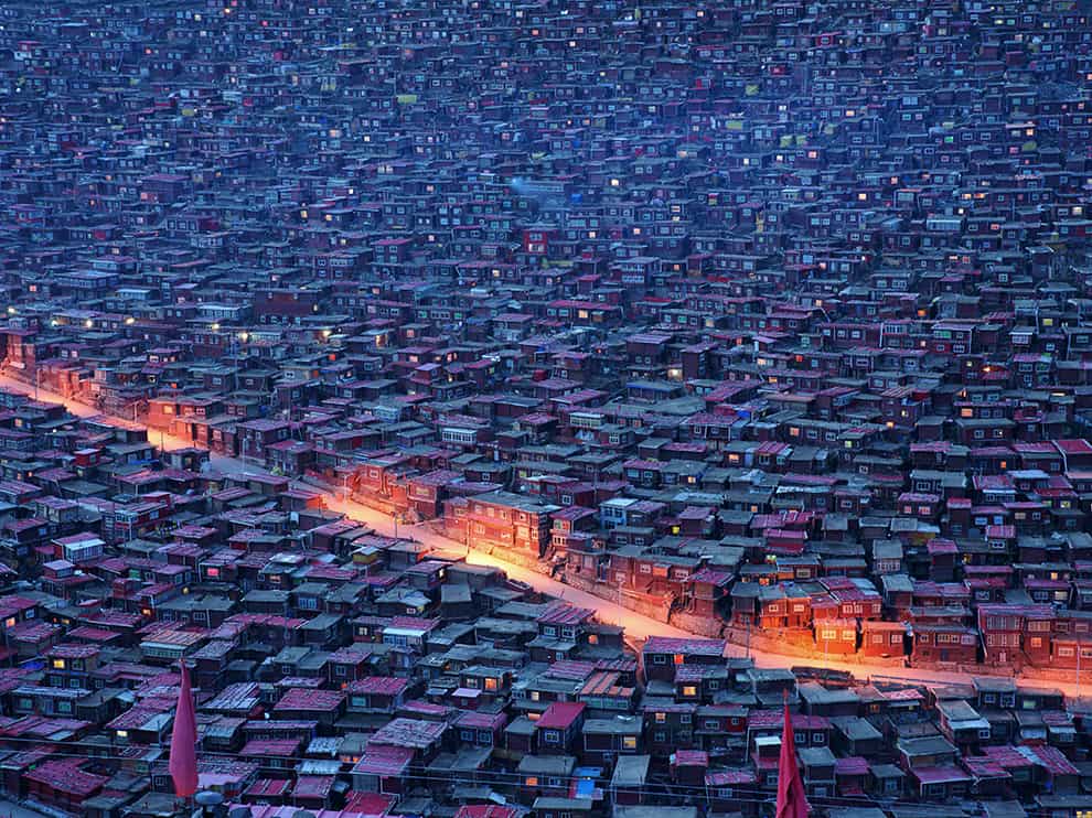Seda Buddhist Institute located in Sichuan Province of China, tens of thousands of believers come here to study Buddhism, they all live in a very small little house with red roof.