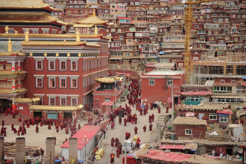 Buddhist nuns and monks walk through Seda Monastery on April 4, 2013