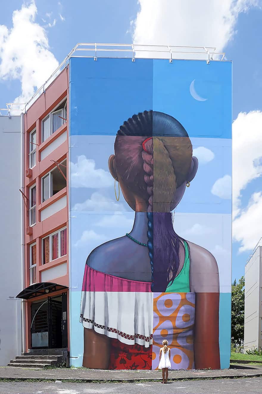 Large mural on building by Julien Malland