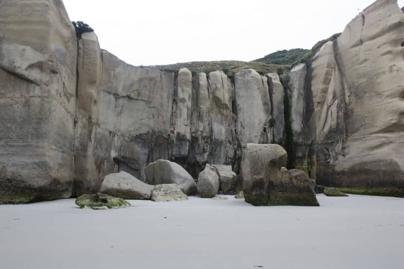 The private beach is surrounded by thick natural rock walls.