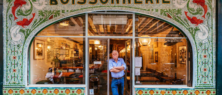 Drew Harré, relaxing at the entrance of his fish and wine restaurant